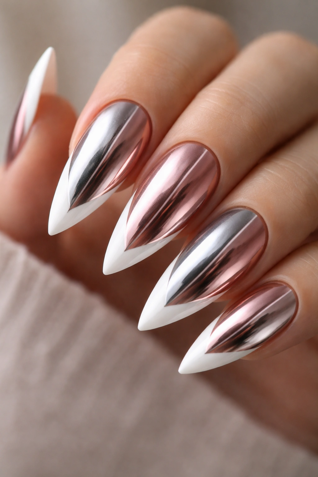 Close-up of two-tone split chrome nails with white tips