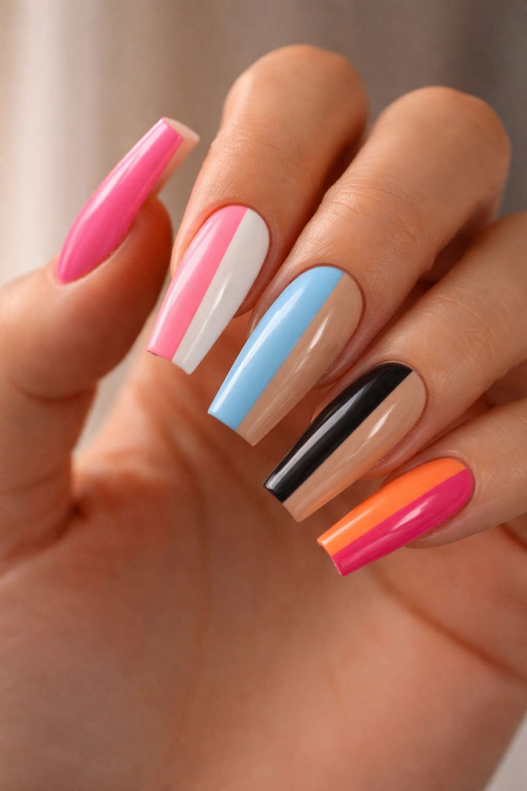 Close-up coffin nails with bold two-tone color blocks