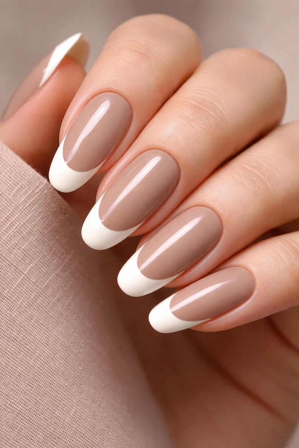 Two-tone French nails with ivory tips and taupe base