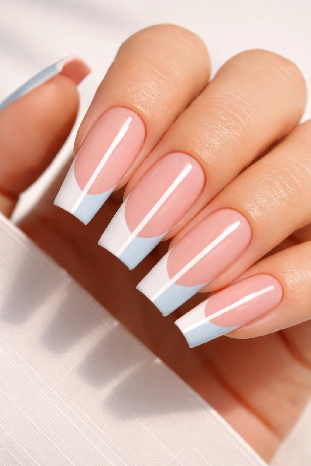 Close-up of two-tone coffin nails with color-block tips and white center line