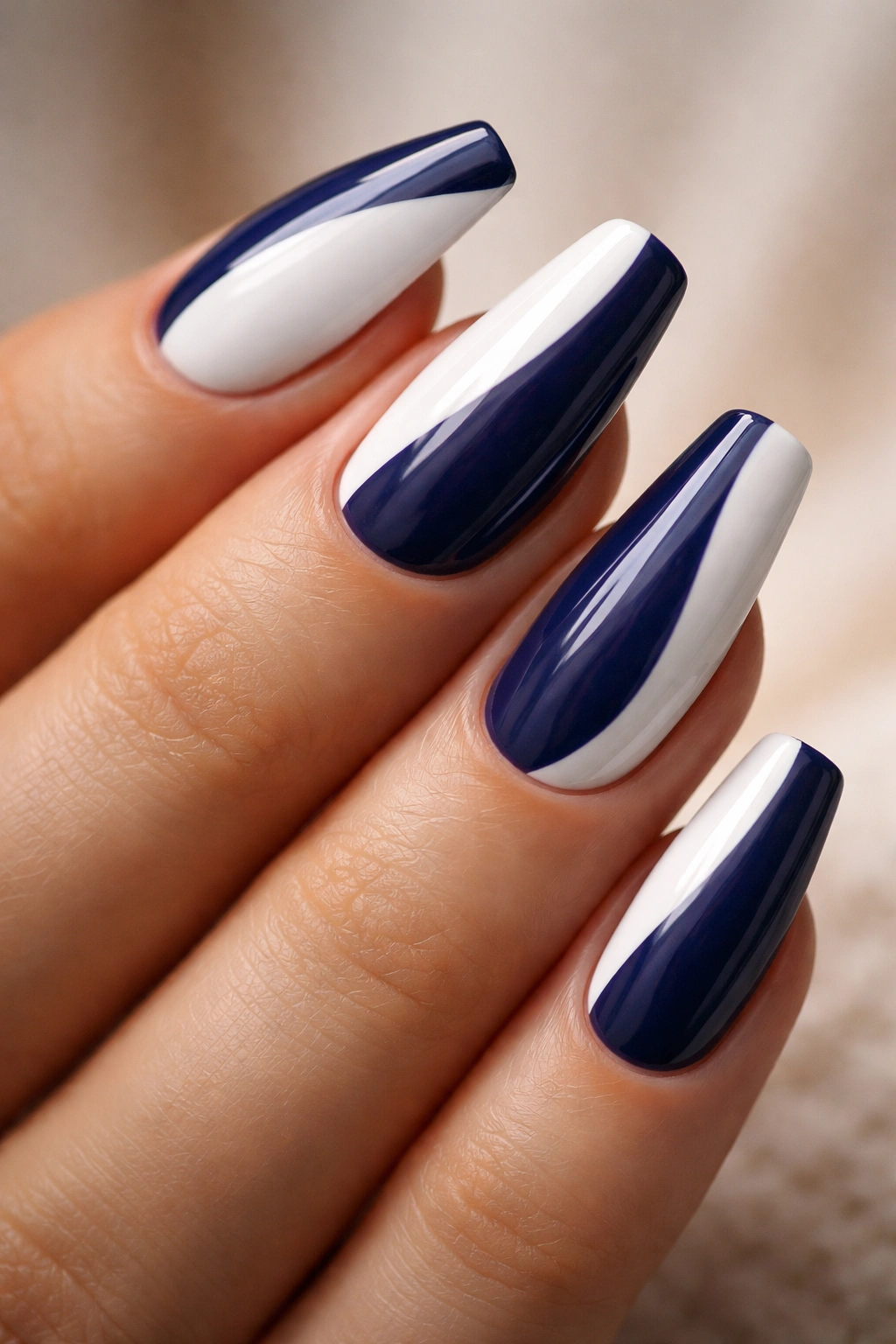 Two-tone curved coffin nails with navy and white color blocks