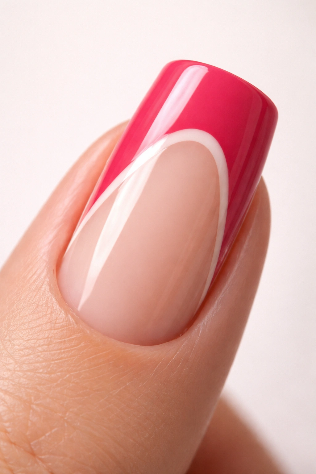 Close-up of slim duck nail with two-tone color and negative space along curved nail