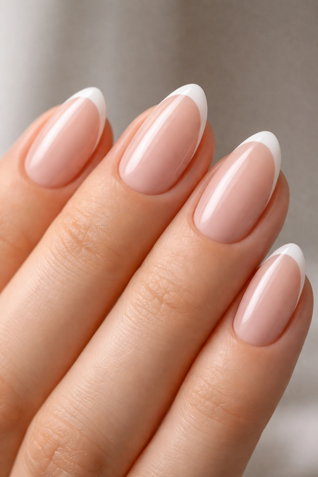 Almond nails with a barely-there white tip