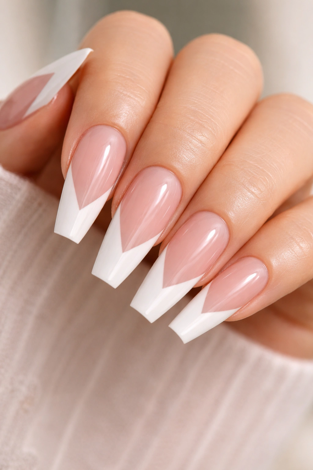 V-cut white tips on sheer pink builder gel nails