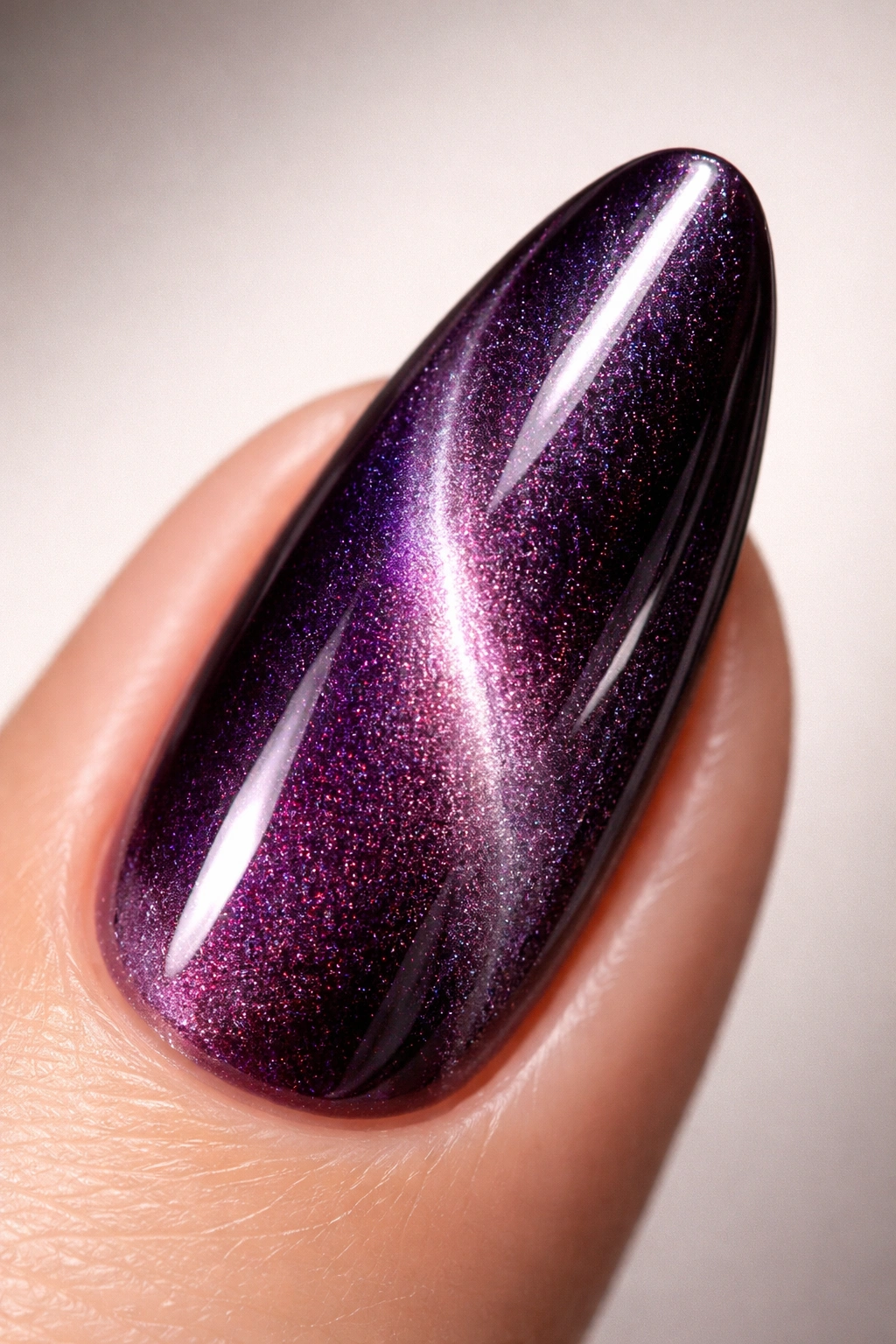 Nail showing velvet cat eye texture with magnetic pattern