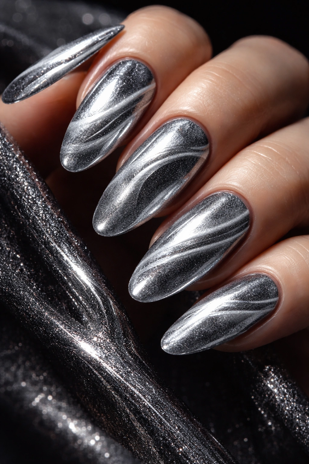 Close-up of velvet-textured chrome nails with magnetic wave patterns
