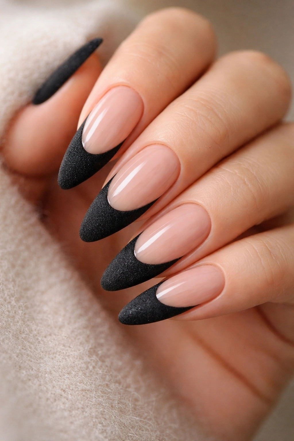 Nails with velvet finish black French tips on nude base