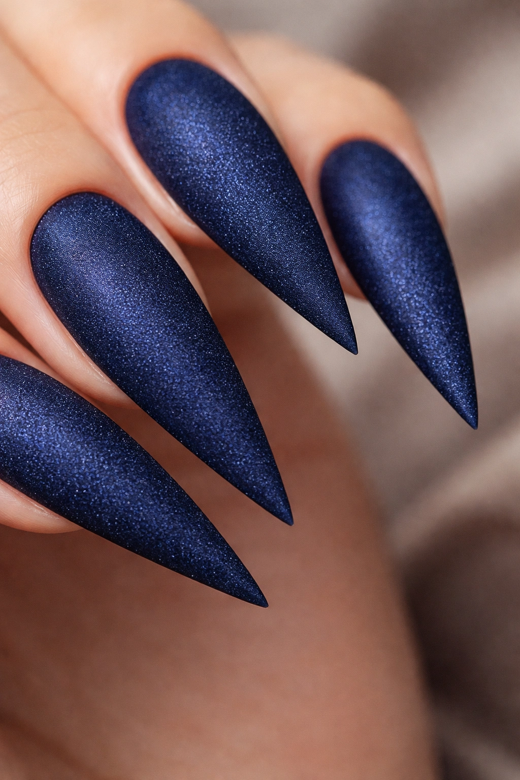 Dark blue velvet matte stiletto nails with textured surface