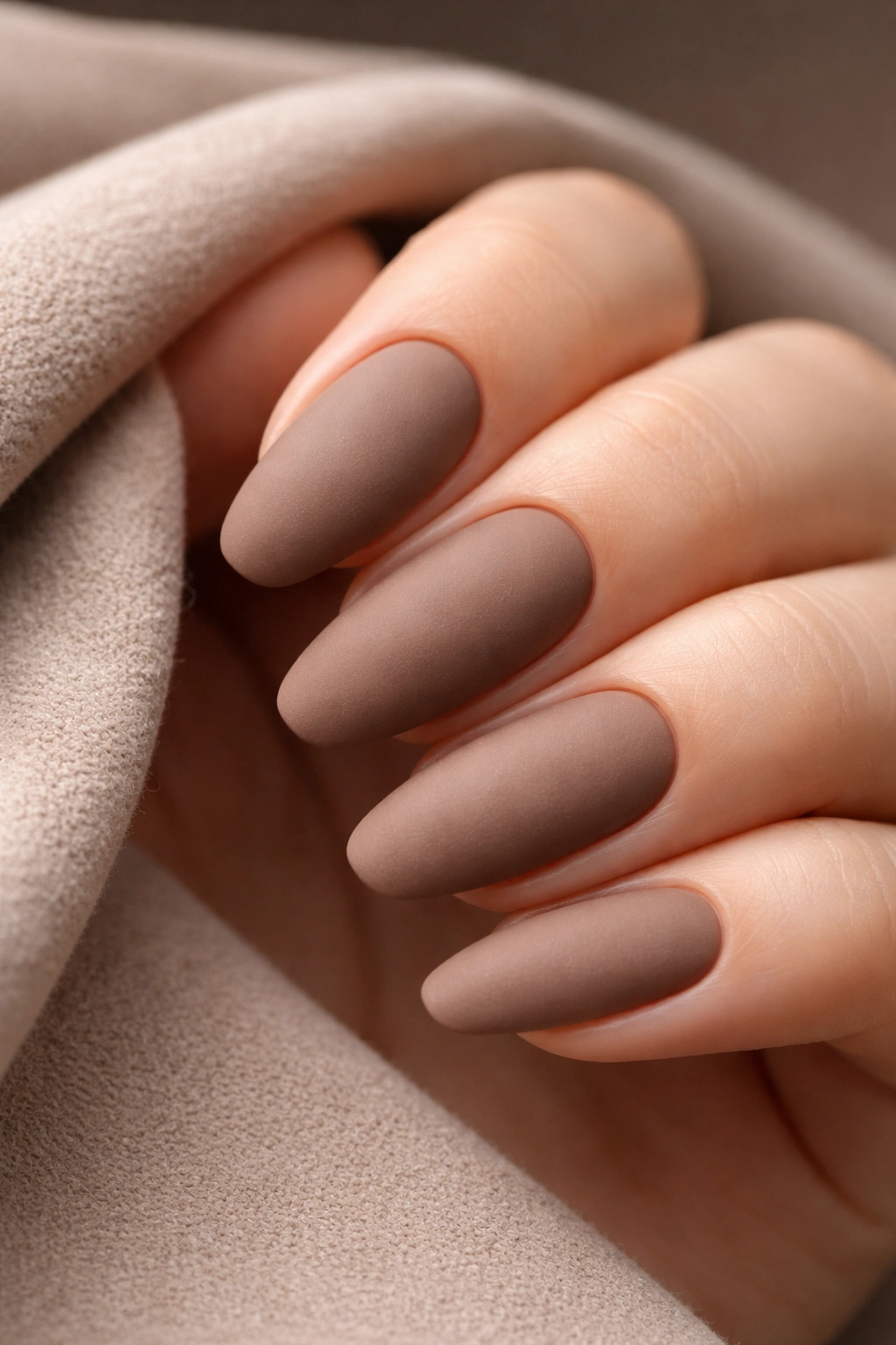 Nails with velvet mocha matte finish showing soft texture