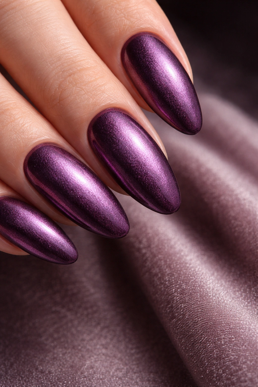 Velvet plum chrome nails with soft matte, powdery texture on a deep plum base
