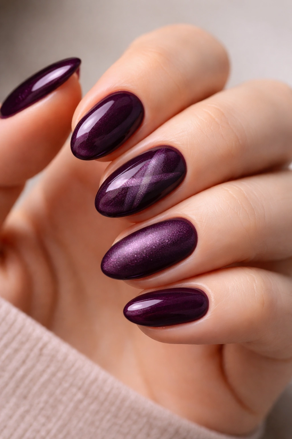 Velvet plum short almond nails in rich shade with glossy finish