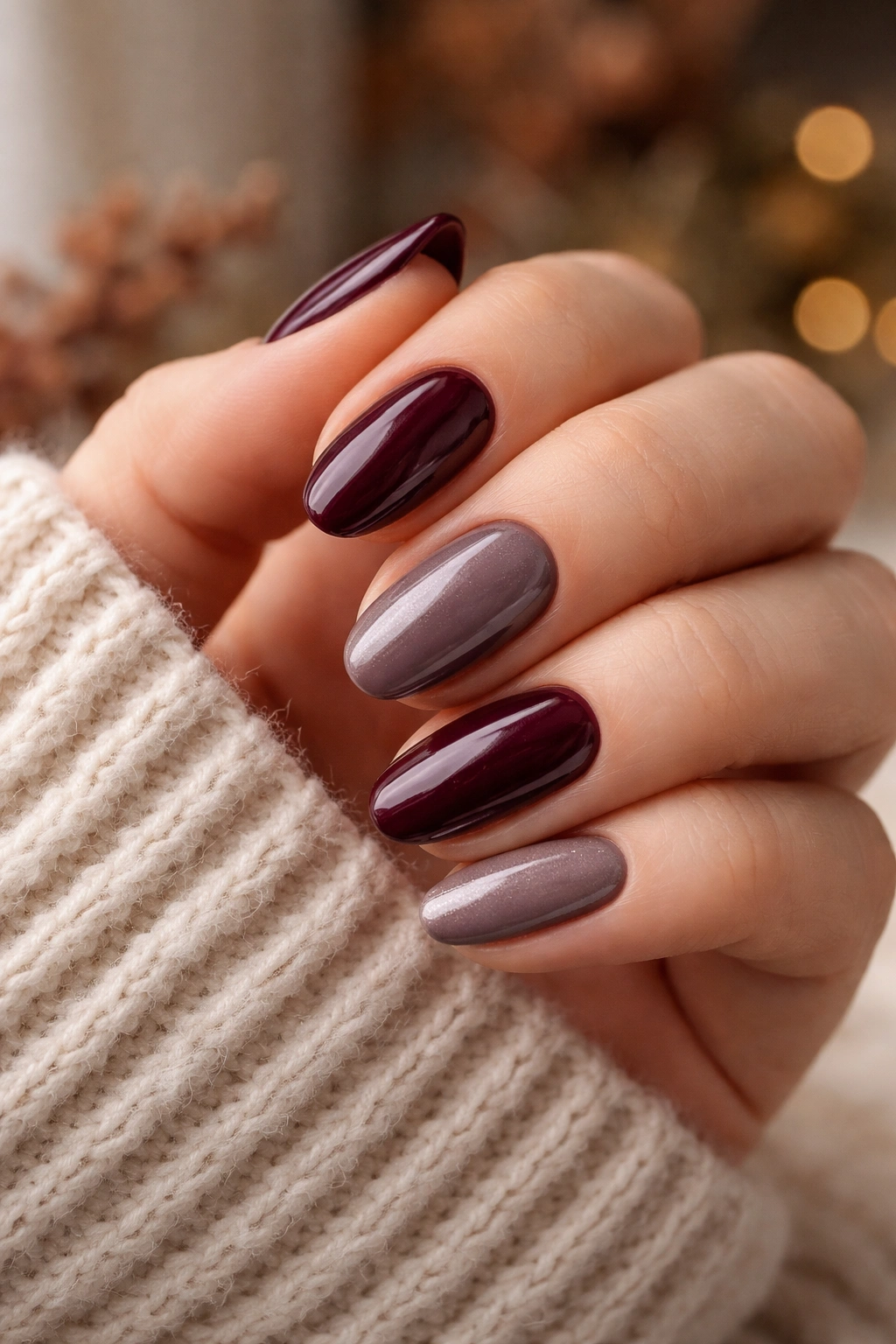 Close-up of versatile burgundy or taupe manicure on a hand