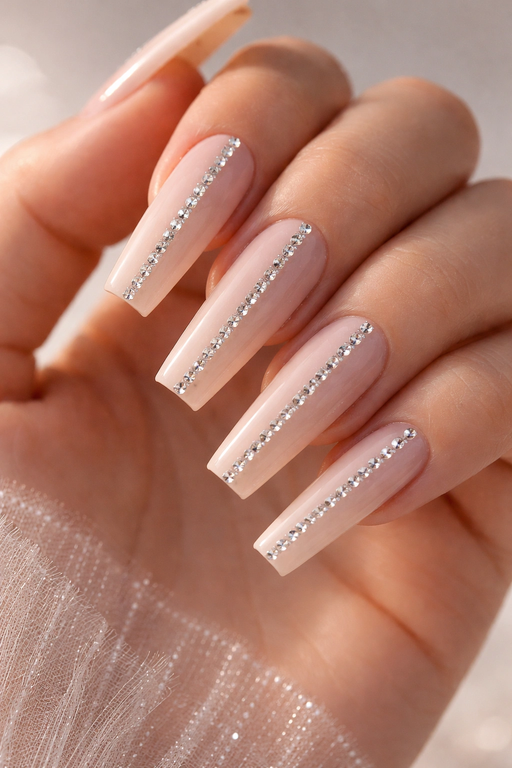 Coffin nails with three vertical lines of rhinestones from cuticle to tip