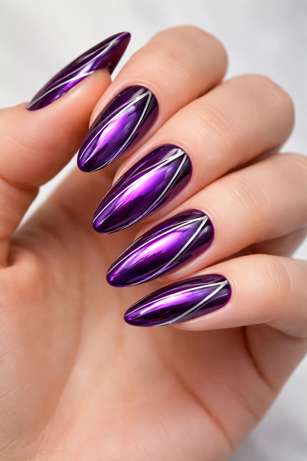 Deep violet chrome nails with silver detailing in thin lines