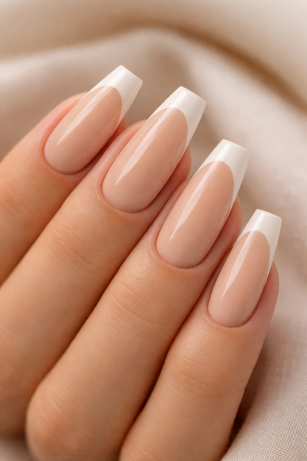 Ballerina nails with warm beige base and cream French ends