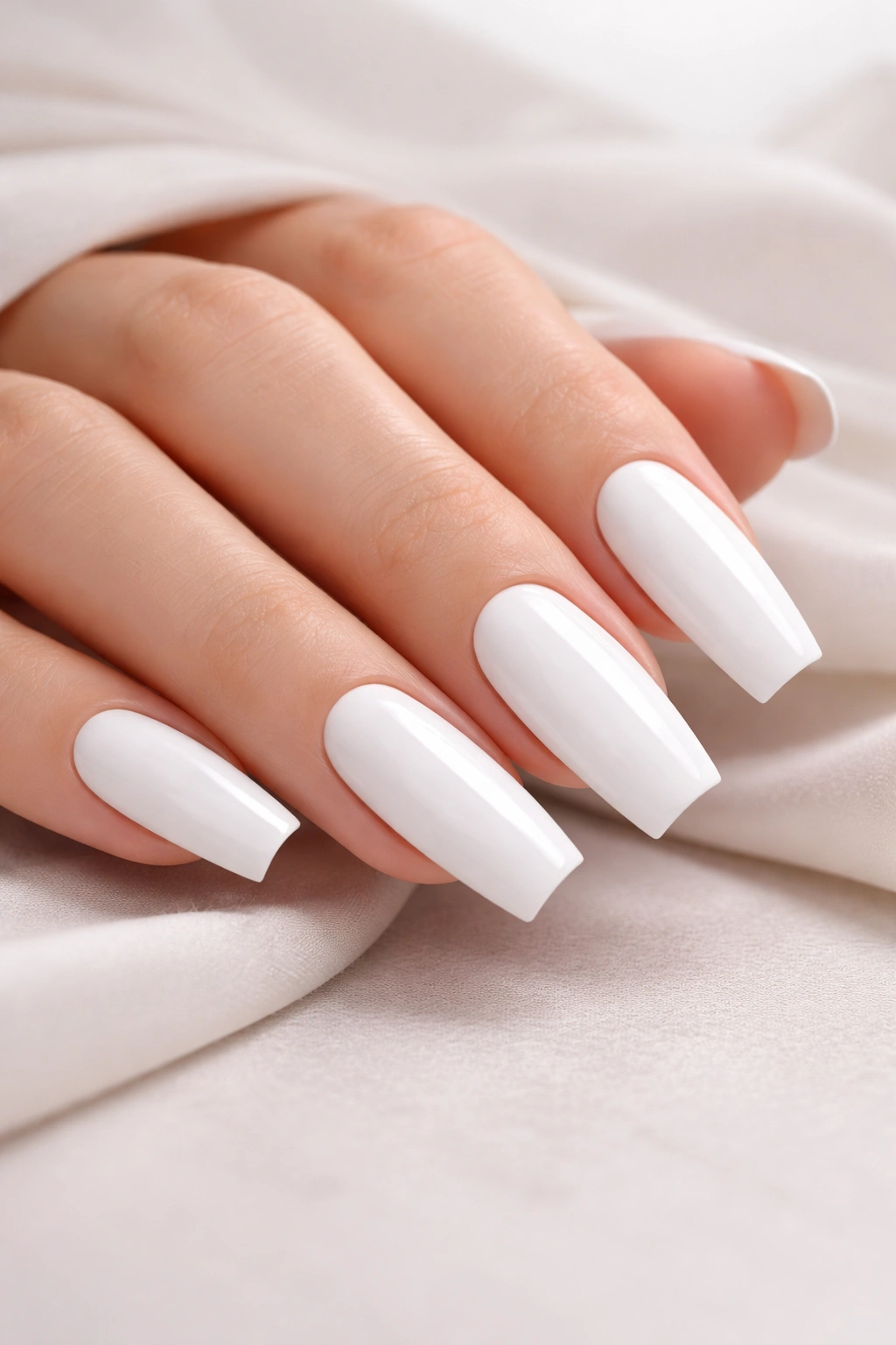 Minimalist white acrylic nails on neutral background