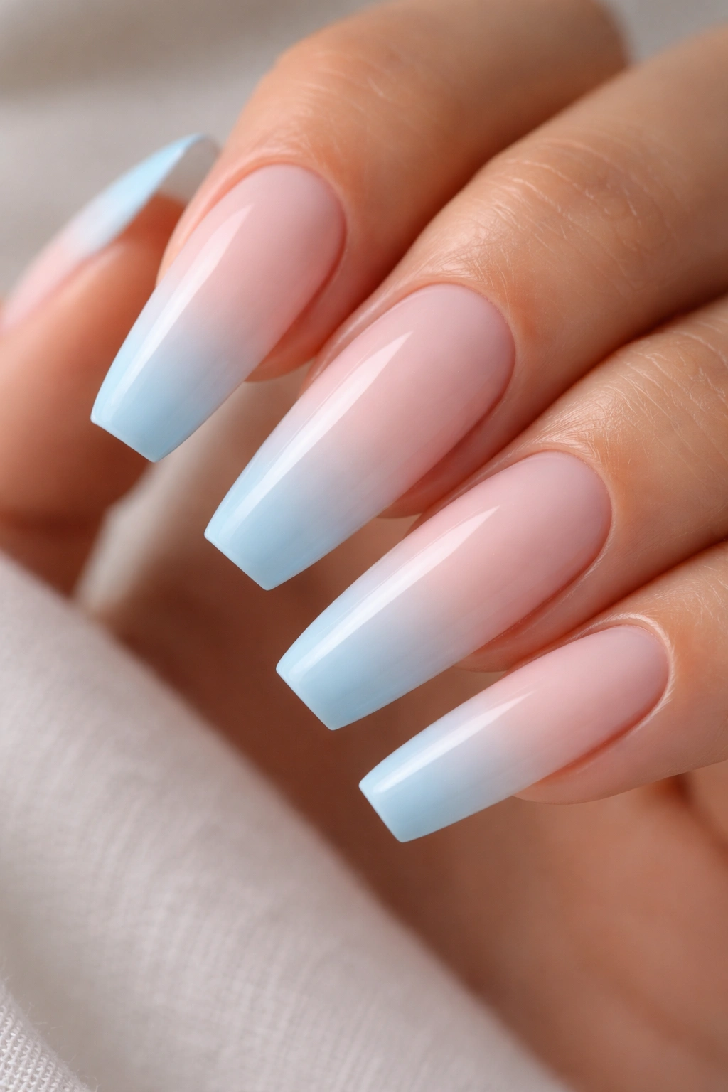 Airbrushed white to blue gradient on a ballerina nail