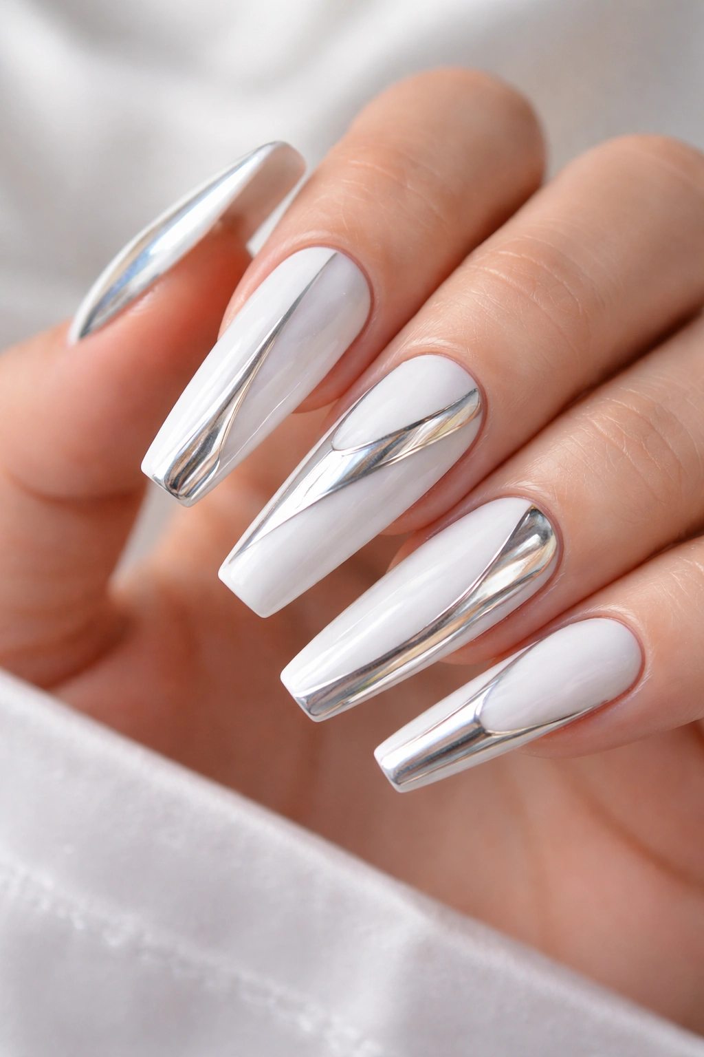 White coffin nails with chrome powder accents reflecting light