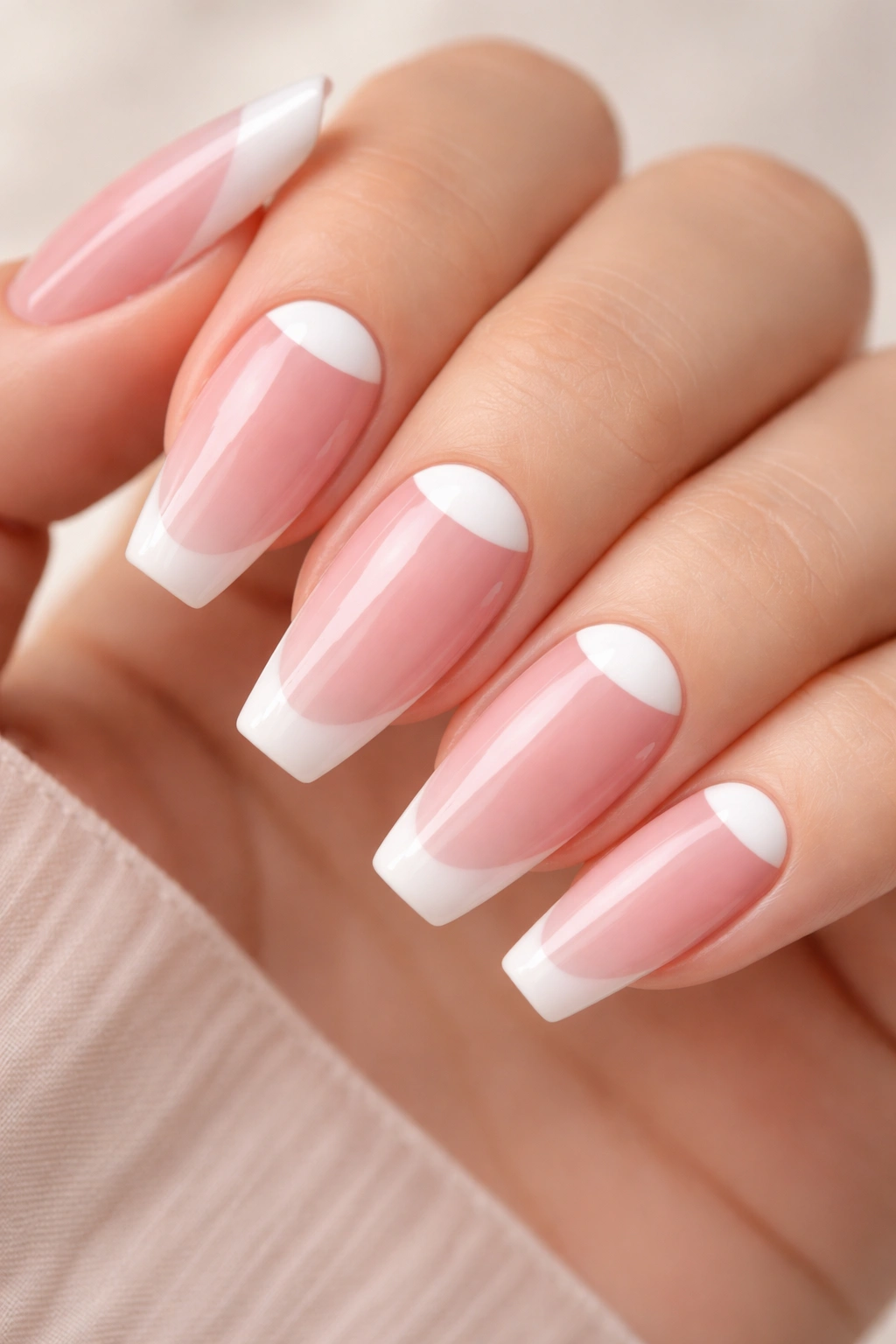 White half-moon nails on blush pink base with crisp cuticle crescent