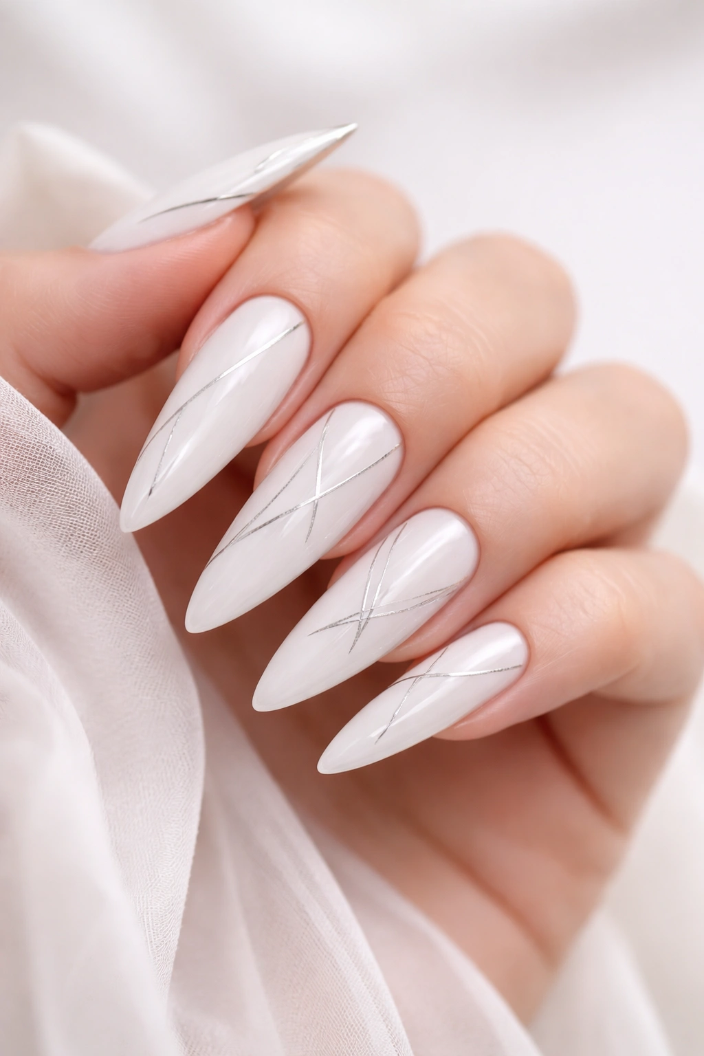 Close-up of white nails with minimalist line art