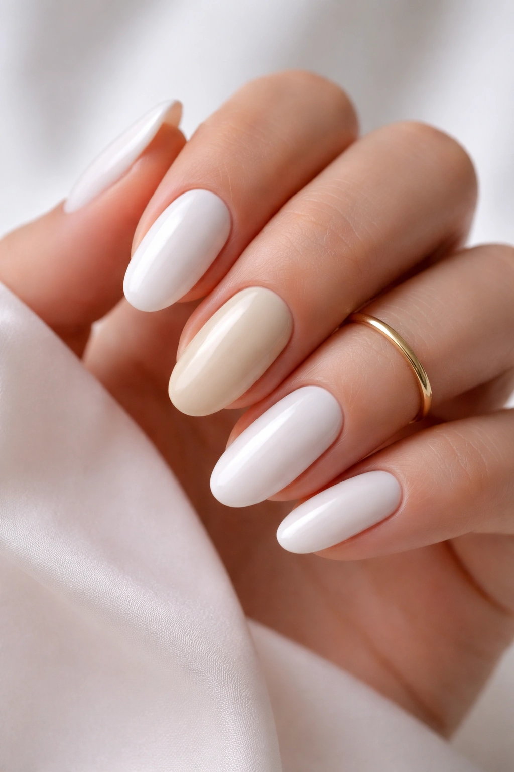 White and cream nails with a gold ring