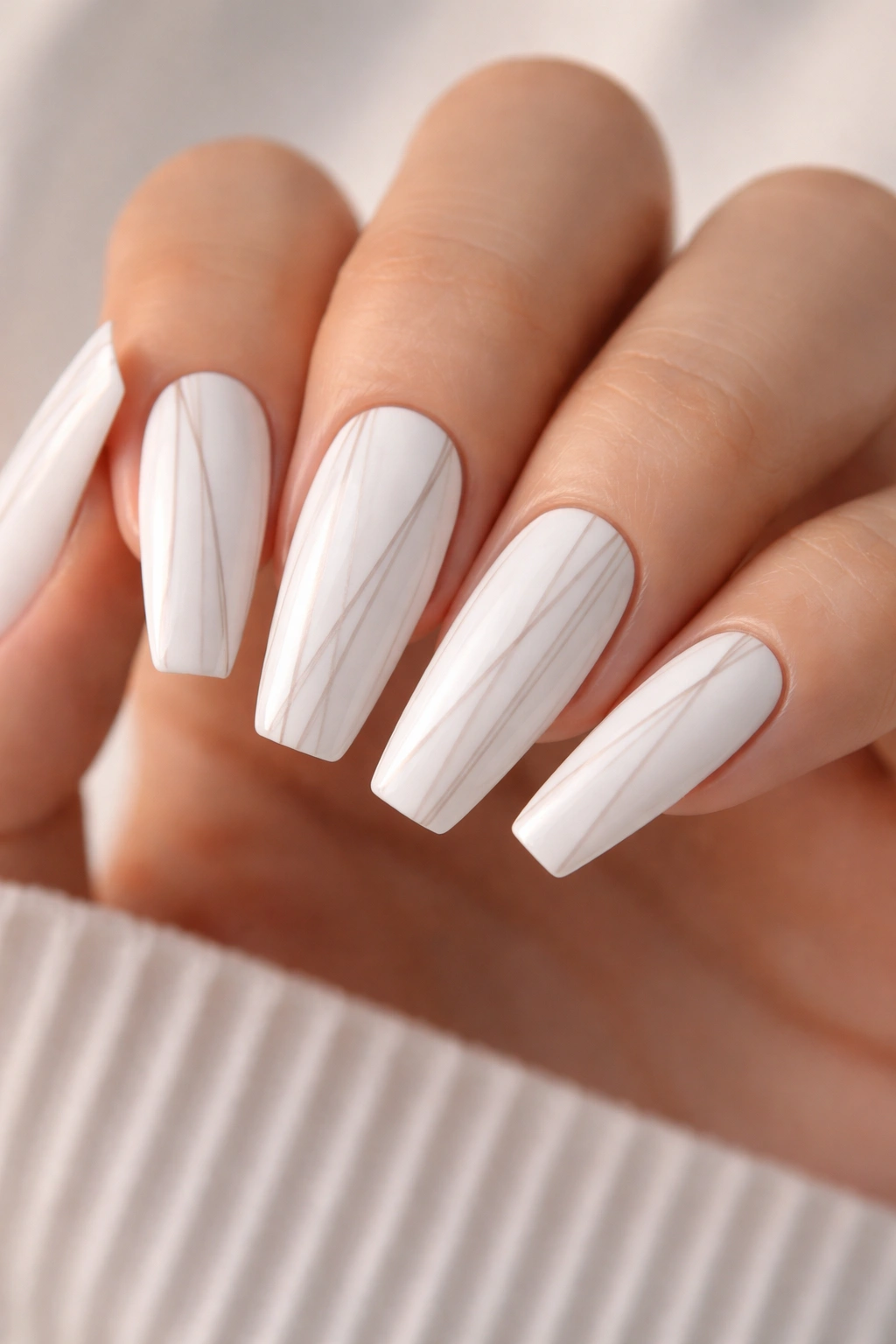 Coffin nails with crisp white base and slim pale stripes