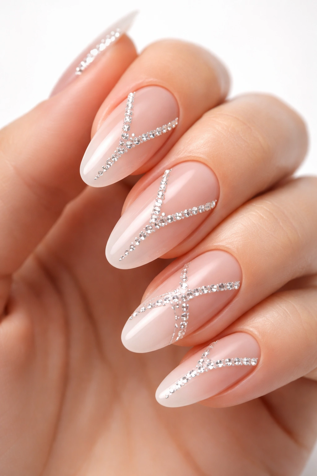 Nails with white rhinestones and negative space geometric pattern