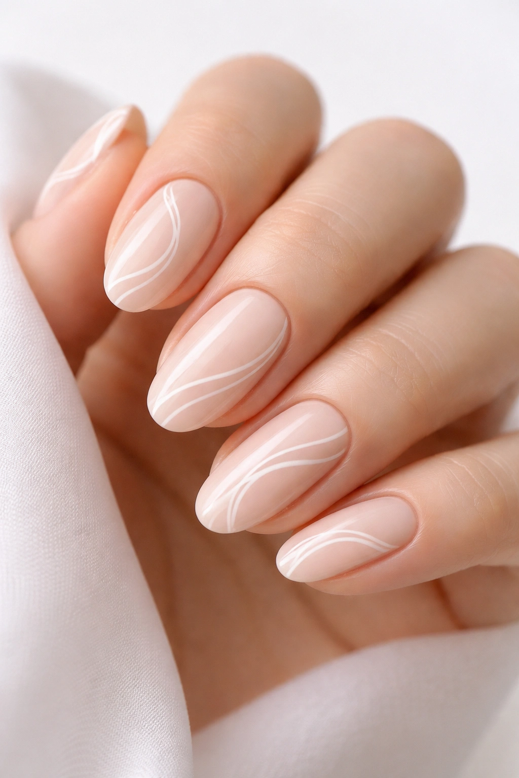Minimalist white swirl nails with delicate lines on neutral base