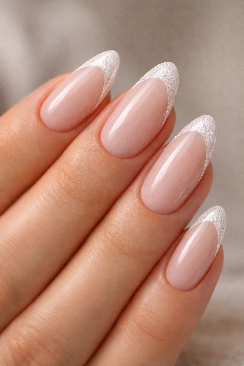 Almond nails with white tips and a thin glitter edge