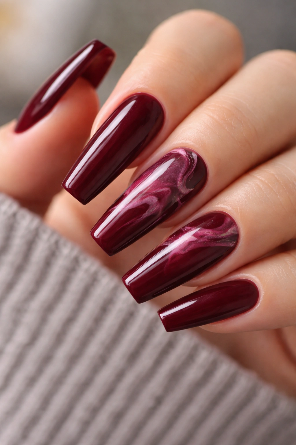 Wine marble ballerina nails with restrained burgundy marbles