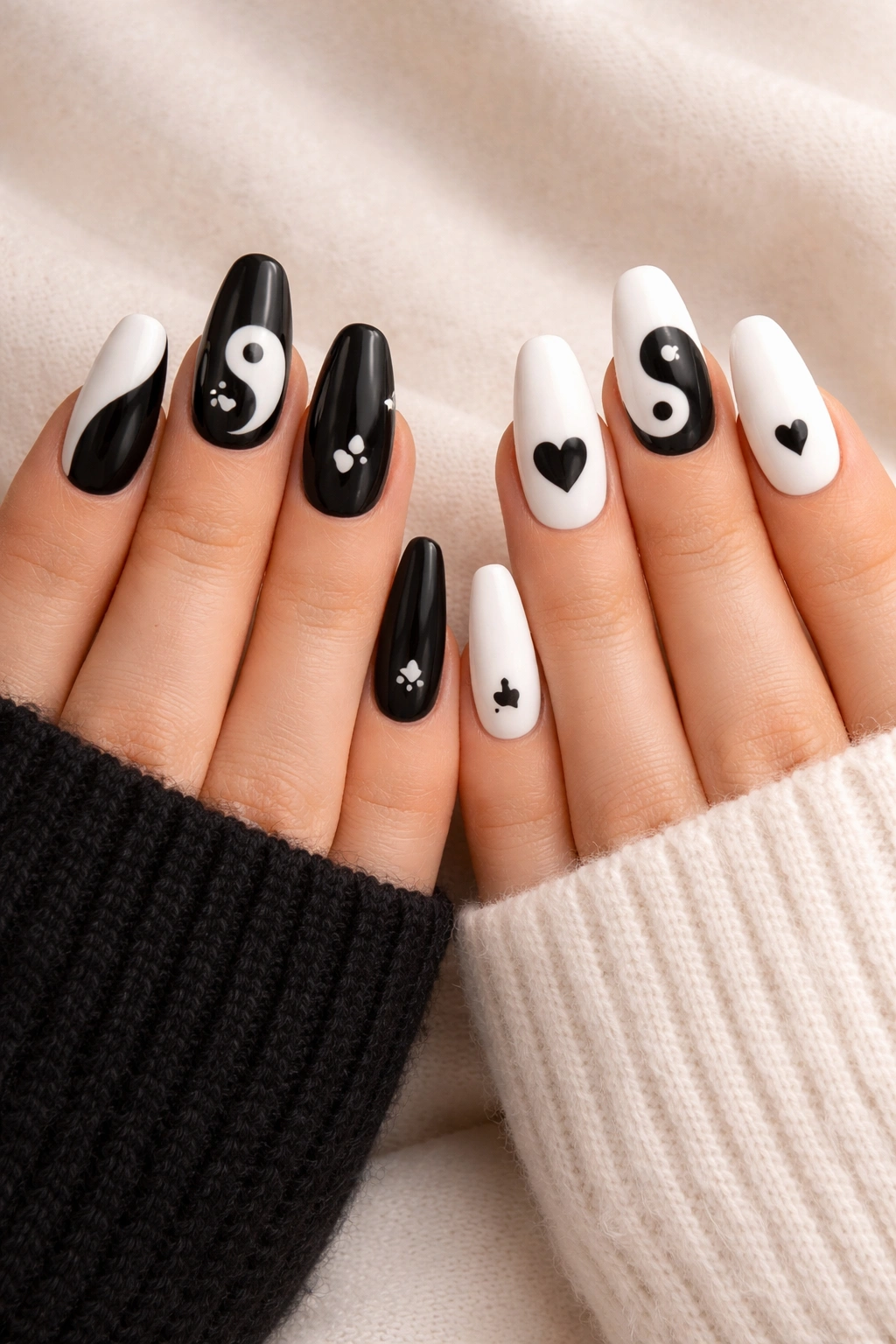Two hands showing yin and yang balance nails in black/white