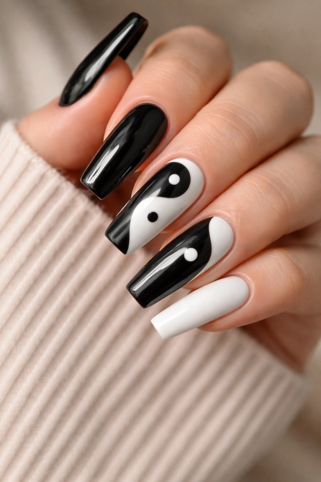 Coffin nails with yin-yang symbols in black and white on accent nails