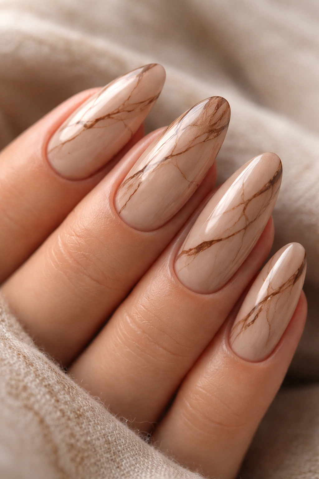 Brown marble almond nails with fine veins