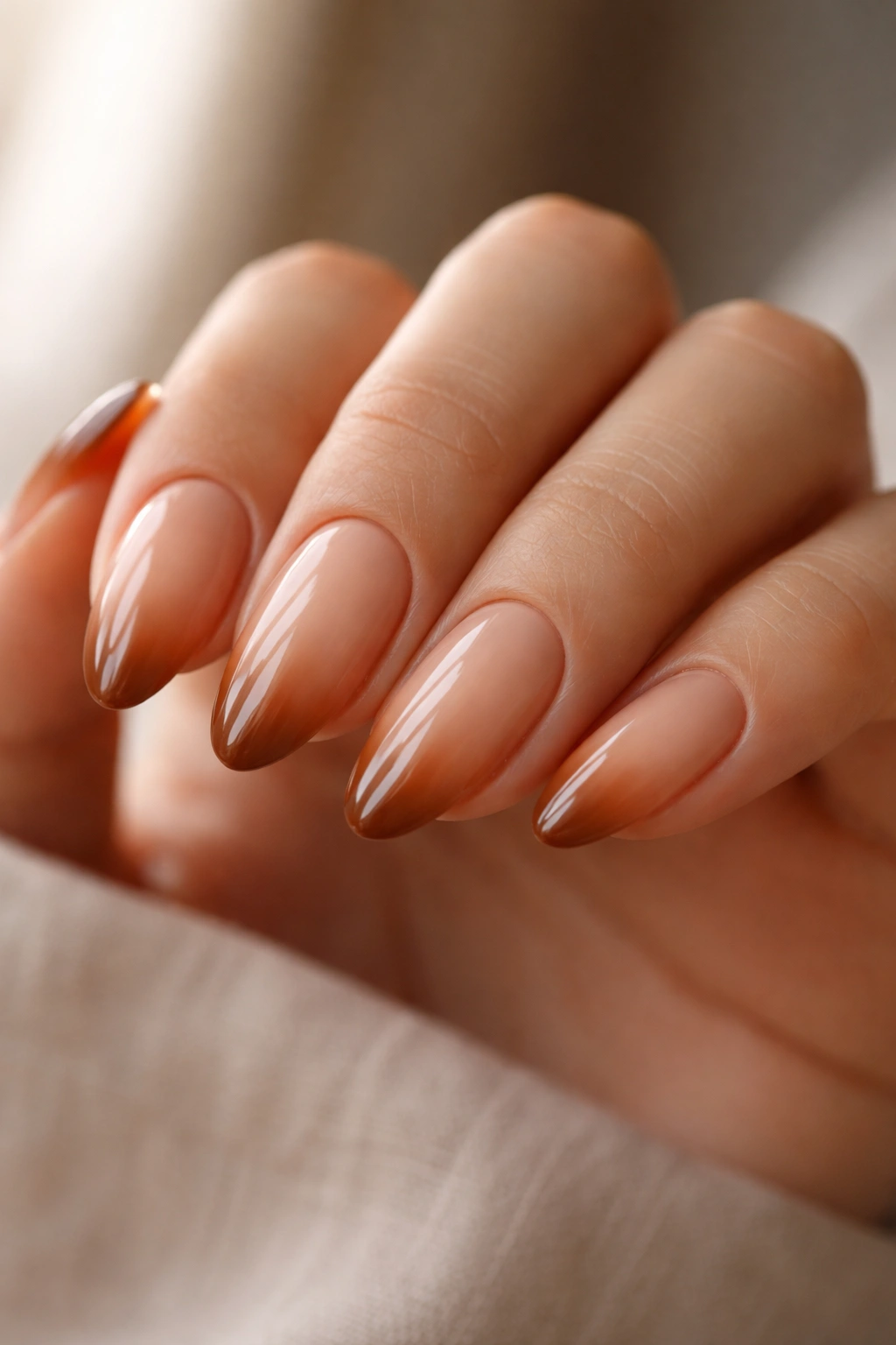 Caramel ombré almond nails with soft tip gradient