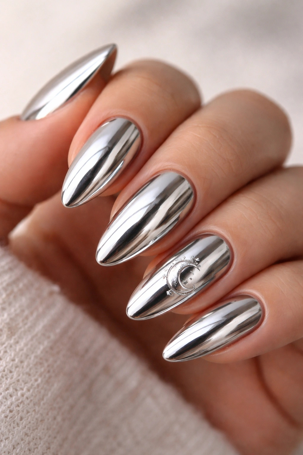 Chrome almond nails with crescent moons