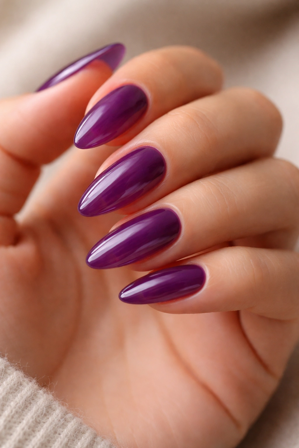 Almond nails in translucent grape jelly finish.