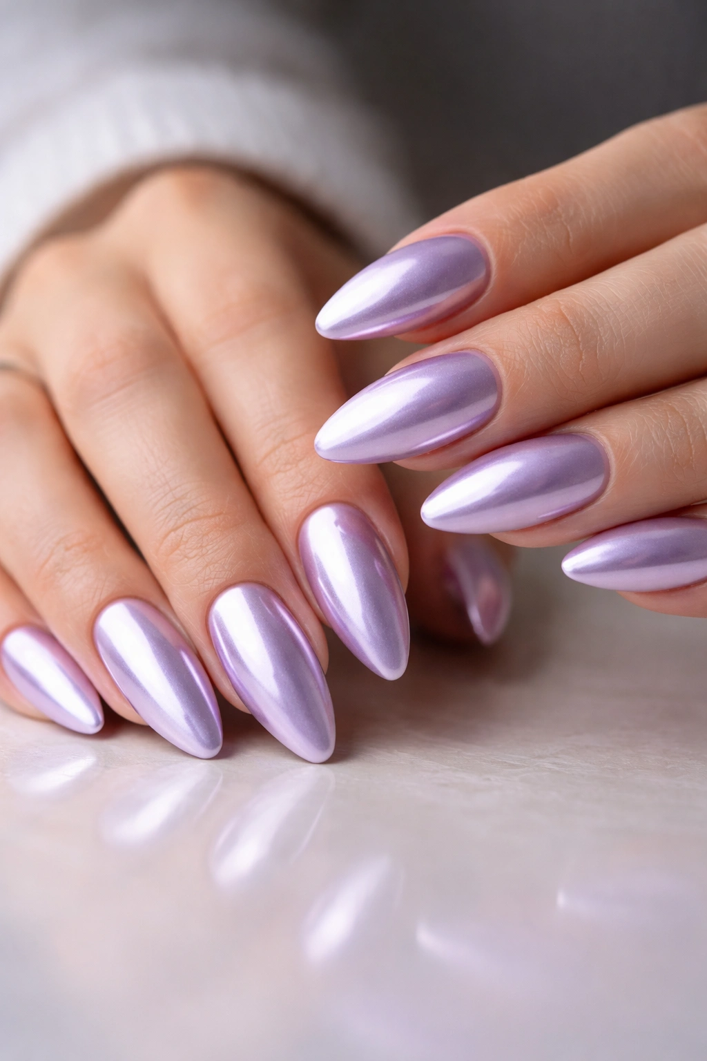 Almond nails with lavender base and chrome mirror finish