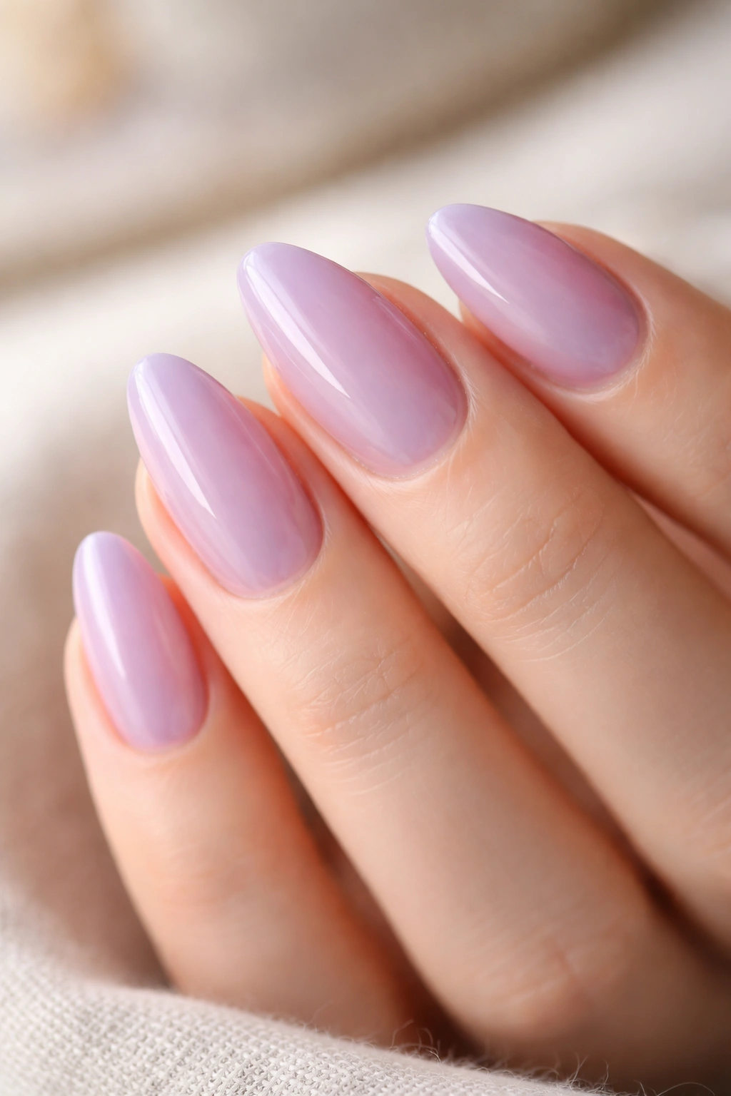 Almond nails with sheer lavender jelly finish showing translucent polish
