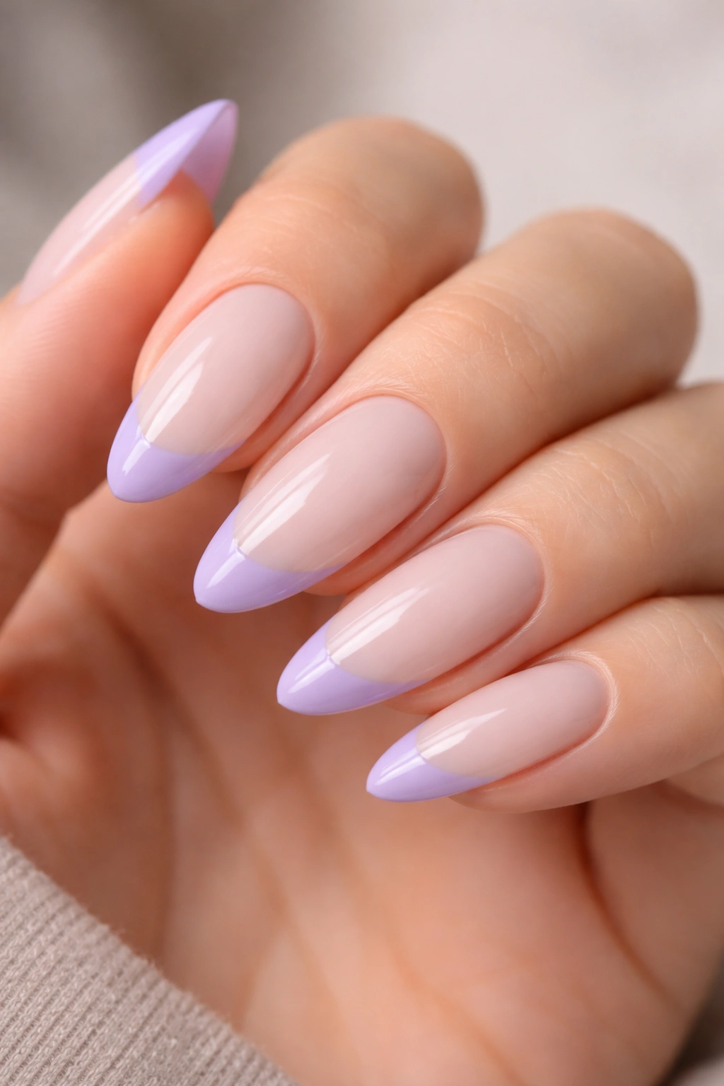 Almond nails with milky base and lavender French tips