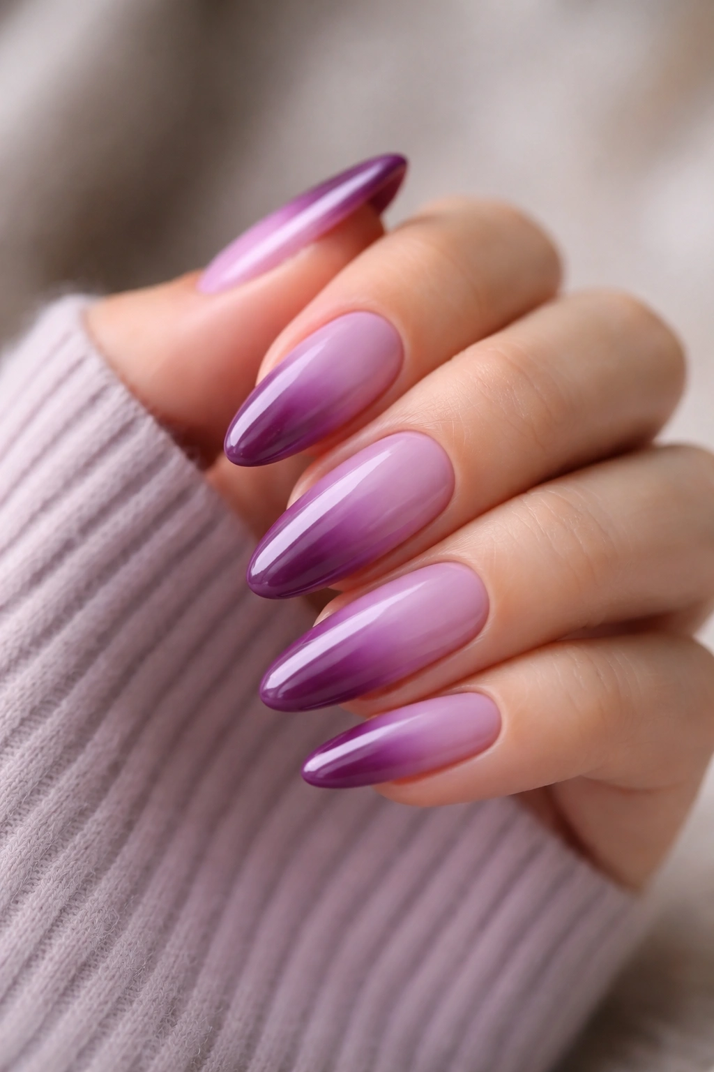 Almond nails with lilac-to-mulberry gradient.