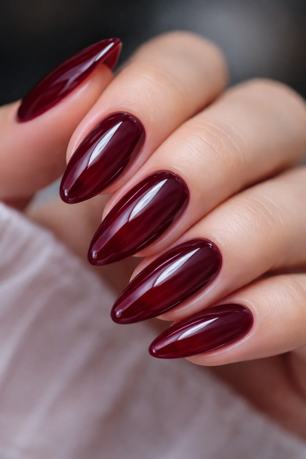 Almond nails with deep wine jelly color and glossy top coat