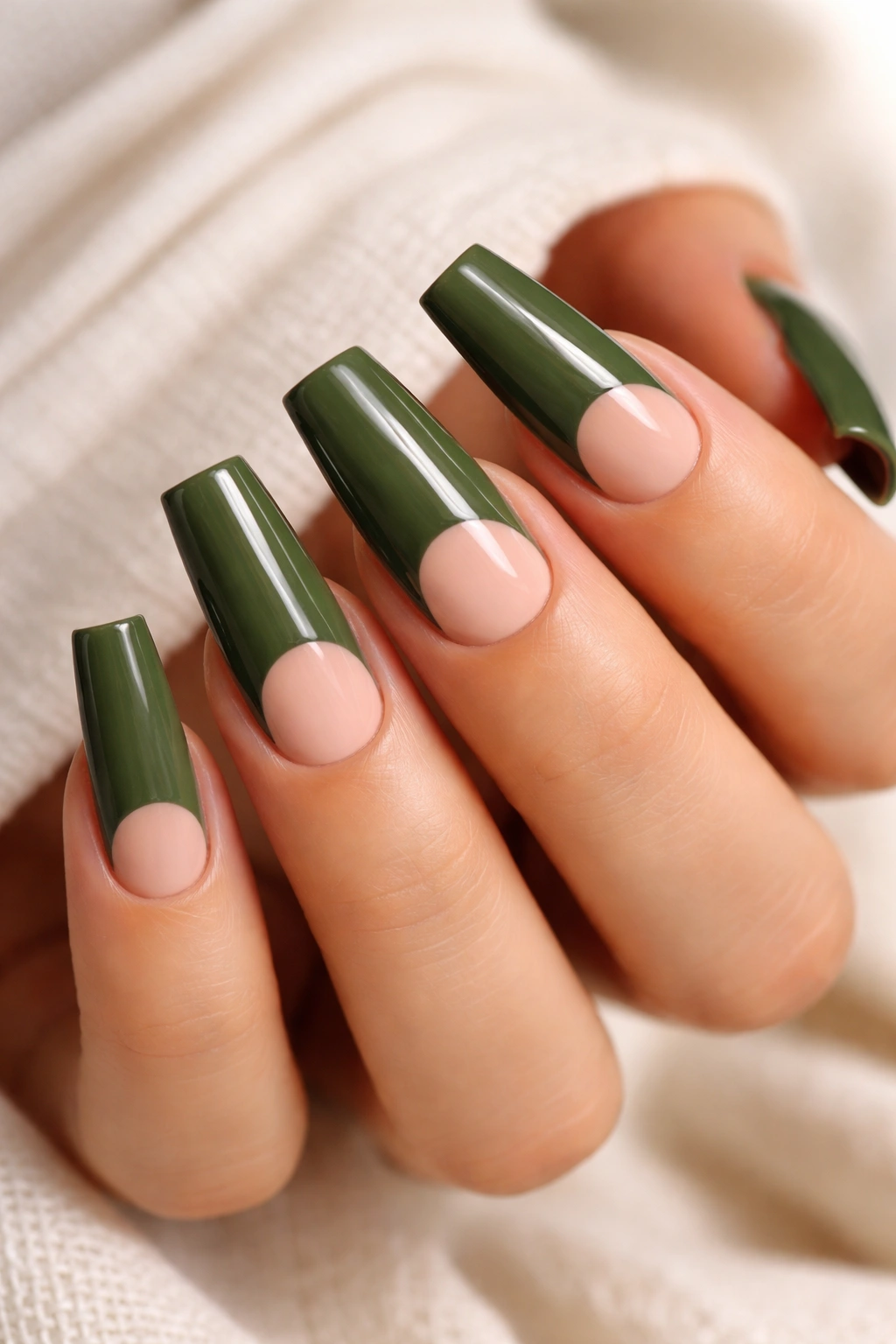 Nude-based coffin nails with army green color and negative-space half moons near cuticle