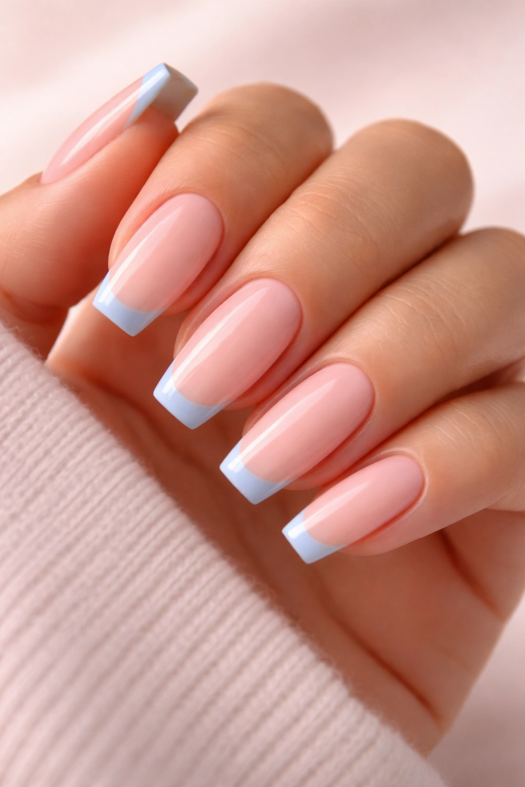 Medium coffin nails with baby blue micro French tip on milky pink base