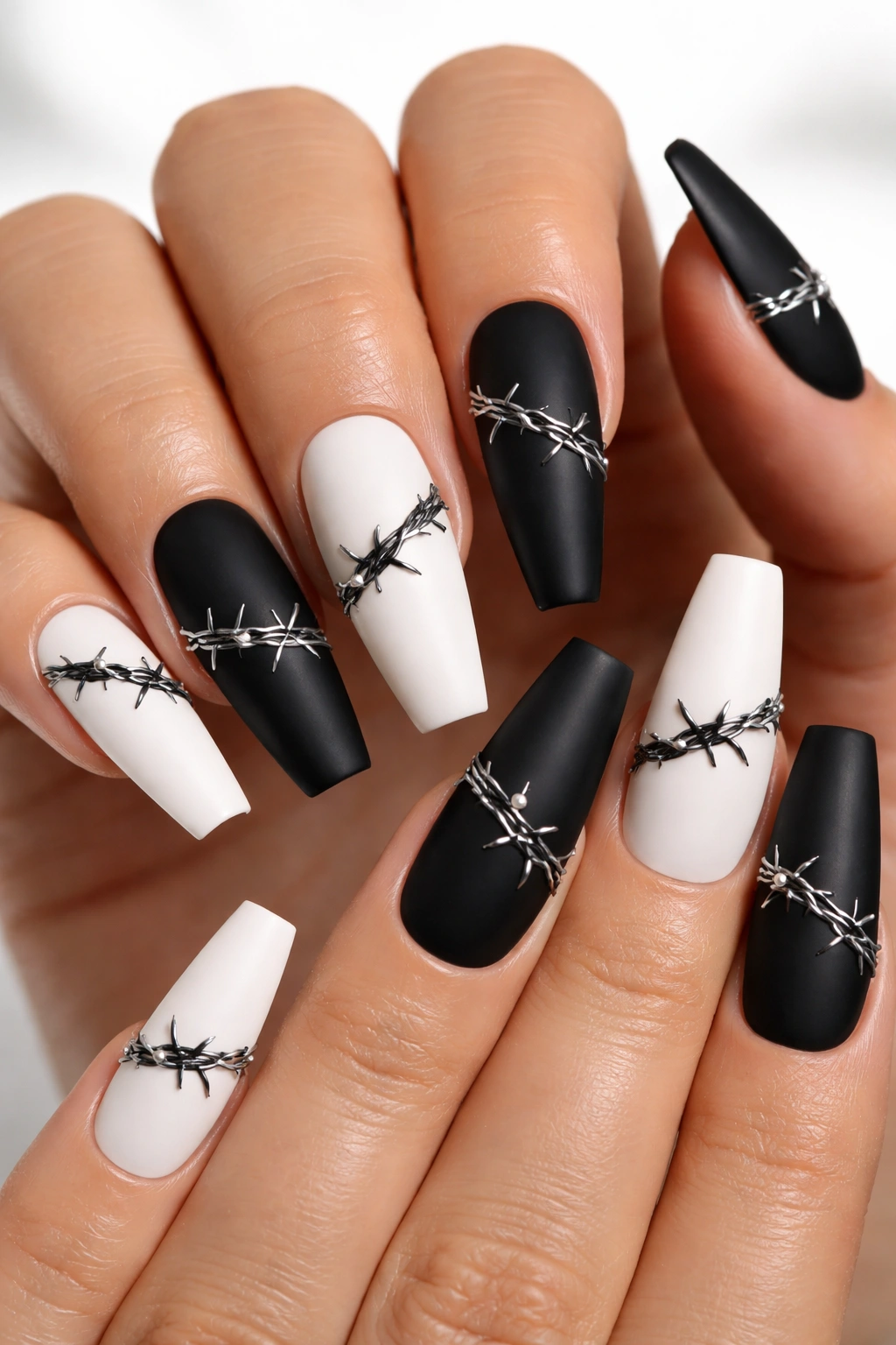 Monochrome coffin nails with thin barbed wire motifs