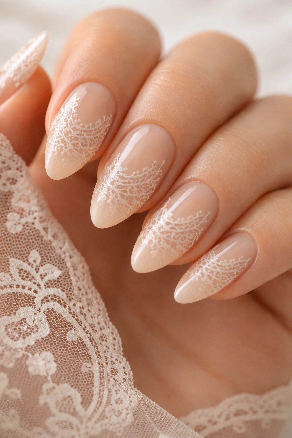 Beige almond nails with fine lace negative space design
