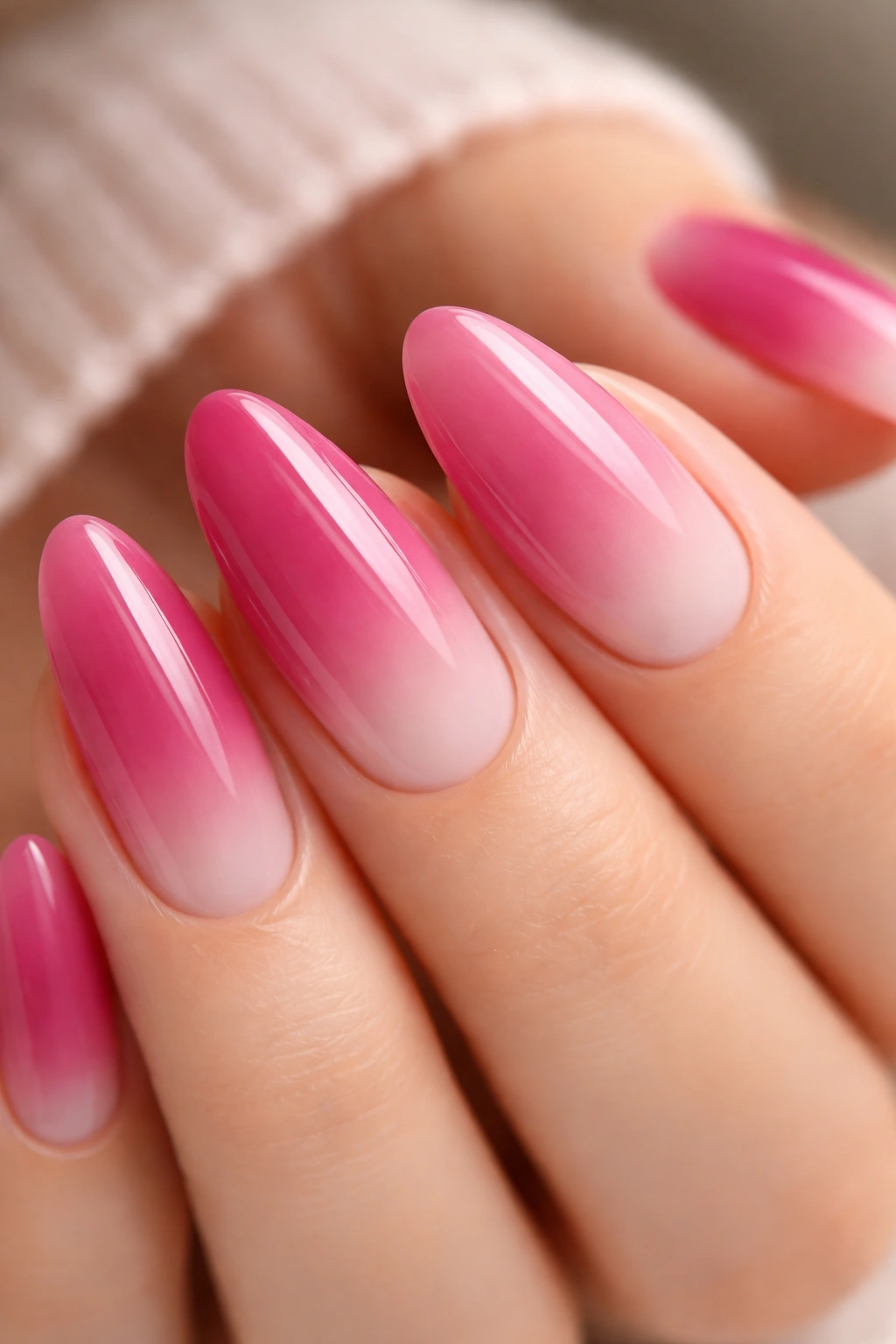 Almond nails berry to petal pink gradient with soft glow