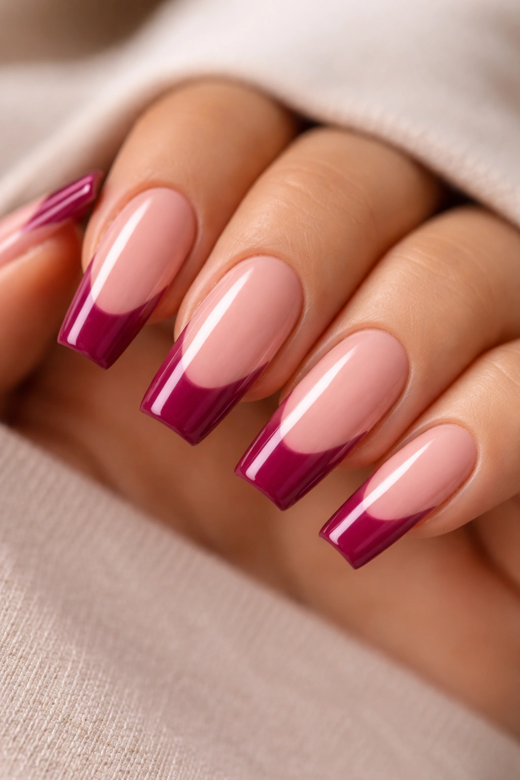 Deep berry pink coffin nails on beige-pink base with curved smile line