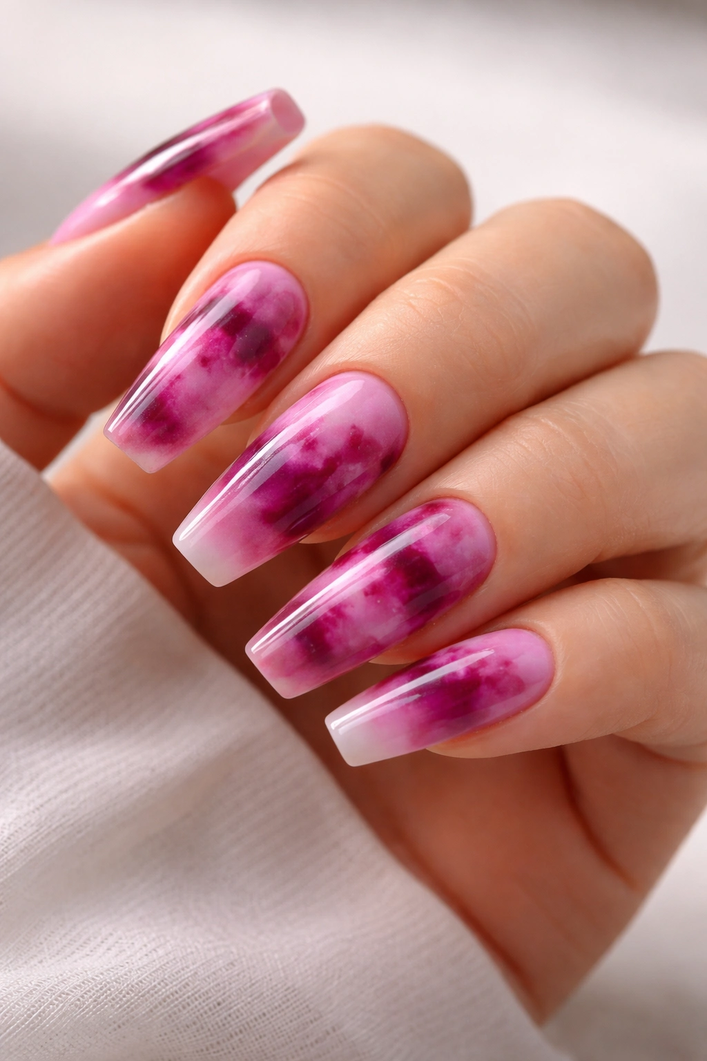 Coffin nails with berry-toned tie-dye patterns on gel base