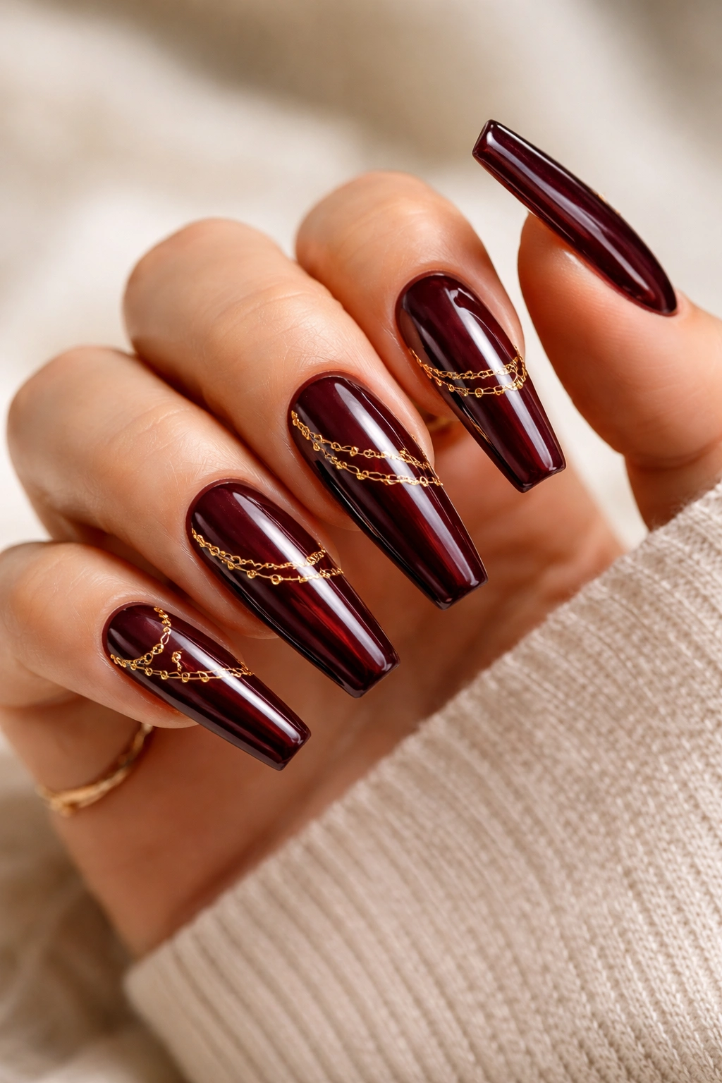 Black cherry red coffin nails with gold chain art, photorealistic