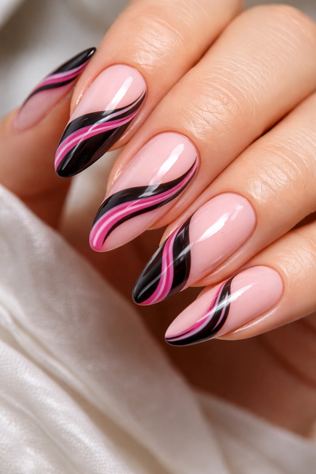 Milky pink almond nails with black swirl lines